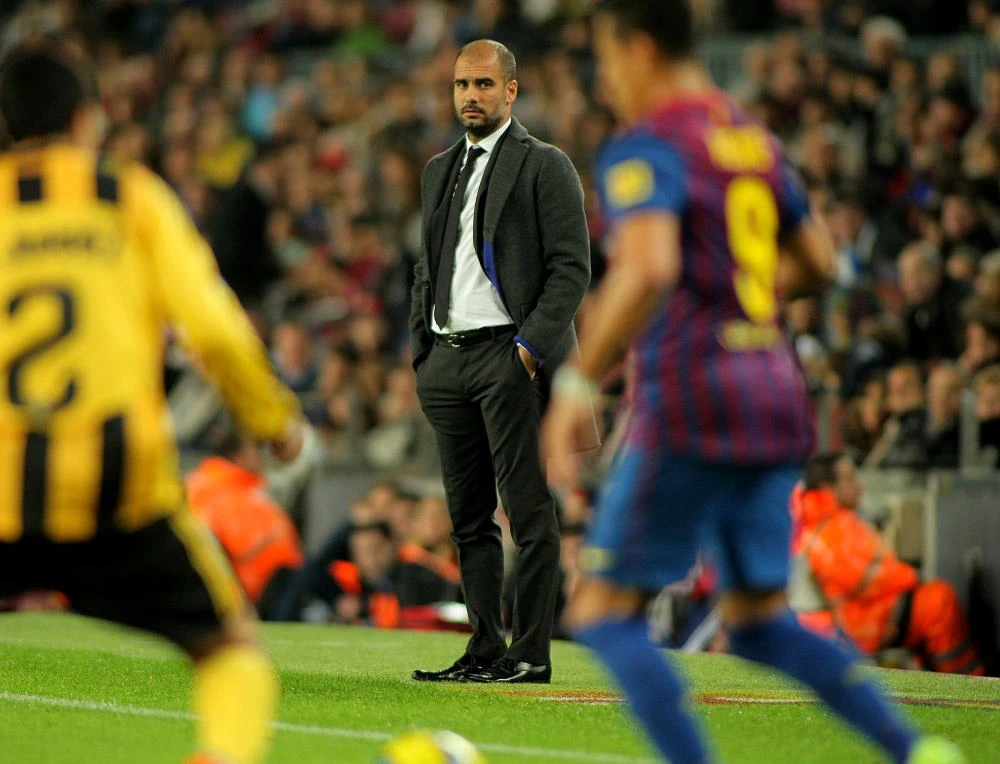 Pep Guardiola terwijl hij Barcelona coachte